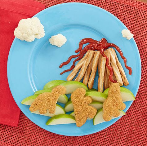 Create this volatile dinner scene with cauliflower clouds, a pretzel volcano, Hunt's ketchup, apple slices, and Banquet dino-shaped chicken nuggets. Your kids will be erupting with excitement. Volcano Snacks For Kids, Dinosaur Nuggets Volcano, Dino Breakfast, Dino Chicken Nuggets, Dinosaur Chicken Nuggets, Kids Food Crafts, Feeding Therapy, Food Art For Kids, Toddler Lunches