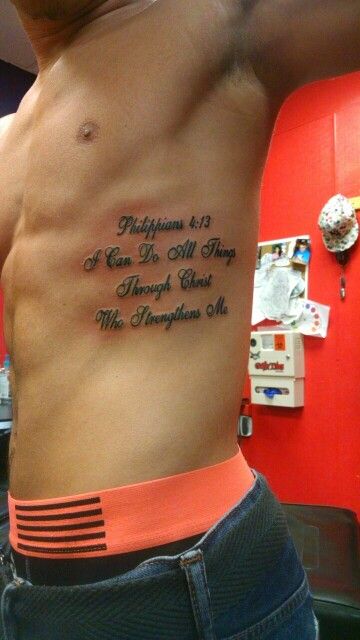 Side Tattoos For Men Ribs Quotes, Family Rib Tattoo, Philipians4:13 Tattoo Men, Rib Writing Tattoo Men, Tattoos On Ribs Men, Bible Verse Stomach Tattoo, Rib Men Tattoo, Men’s Small Rib Tattoos, Ribs Quote Tattoo