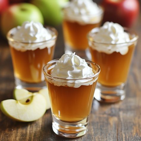 🍏🍮 Dive into these Caramel Apple Jello Shots for a fun, tasty treat! 🍏✨ #PartyTime #FunRecipes Caramel Apple Jello Shots Ingredients: Apple cider (1 cup) Caramel vodka (1 cup) Unflavored gelatin (2 packets) Caramel sauce (for garnish) Whipped cream (for garnish) Apple slices (for garnish) Instructions: Heat apple cider until warm. Add gelatin and stir until dissolved. Remove from heat and mix in caramel vodka. Pour into shot glasses and refrigerate until set. Garnish with caramel sauce, w... Jello Shots With Caramel Vodka, Caramel Vodka Pudding Shots, Apple Cider Jello Shots With Fireball, Caramel Apple Jello Shots, Caramel Infused Vodka, Apple Jello Shots, Caramel Apple Jell-o Shots, Caramel Vodka, Instagram Recipes