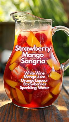 Summer calls for refreshing drinks, and nothing says refreshment quite like a chilled glass of Strawberry Mango Sangria. This blend is a favorite because it mixes sweet strawberries and luscious mango with a crisp white wine, infused with a hint of citrus from limes and lemon. #strawberrymangosangria Mango Sangria Recipes, Drinks With Wine, Summer Alcoholic Drinks, Adult Summer Party, Mango Sangria, Summer Drinks Alcohol Recipes, Homemade Sangria, Drinks Summer, Summer Drinks Alcohol