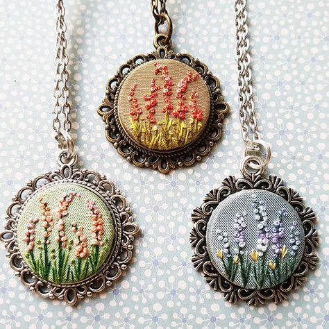 A garden of embroidered pendants. #embroidery #gardenembro… | Flickr Hand Embroidered Jewelry, Garden Embroidery, Mini Embroidery, Miniature Embroidery, Embroidered Necklace, Embroidered Jewelry, Pola Sulam, Brazilian Embroidery, Embroidery Flowers Pattern