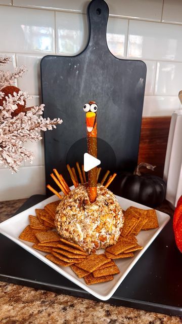 Home|Hosting|Holidays|Decor|Recipes on Instagram: "Hosting Thanksgiving! Save this!!

My Thanksgiving Turkey Cheeseball is everyone’s favorite! 🦃
It literally takes 5 ingredients to make and it will be a complete hit! Kids love it and it dresses up your Charcuterie table or board. Not to mention it’s easy, requires zero baking and everyone will want your recipe. So here ya go! 

You’ll need 1 package of cream cheese room temp.
1/2 cup shredded cheese 
1 small can of diced green chilies 
1/2 cup shredded or even canned chicken 
Crushed nuts of choice. I used pecans 

Dump all of the first 4 ingredients in a bowl mix and form a ball. Next, roll the ball in your crushed pecans. 
Your cheese ball is done.

To make it into a Turkey! Take a large pretzel stick and using a dab of frosting add a Turkey Cheeseball, Charcuterie Table, Charcuterie Appetizers, Thanksgiving Snacks, Fall Appetizers, Thanksgiving 2024, Turkey Cheese, Recipes Fall, Thanksgiving Treats