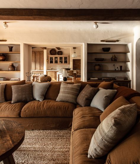 Northwestern Interior Design, Rustic Warmth Living Rooms, Outdoor Inspired Living Room, Family Living Room Ideas Modern Comfy, Forest Interior Design Living Room, Sectional Living Room Cozy, Rust Sectional Living Room, Cozy Mediterranean Living Room, Comfortable Home Decor Cozy Living