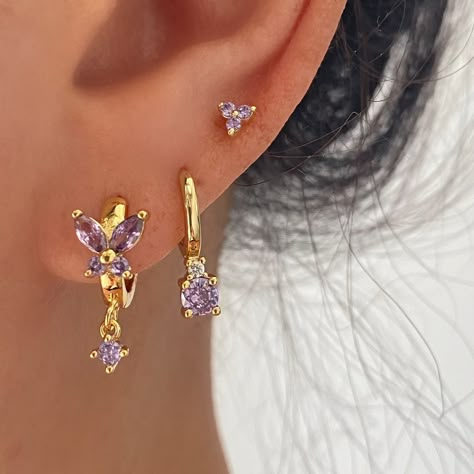 Earrings Thirds, Triple Stud Earrings, Pretty Helix Piercing, Pink And Gold Earring Stack, Purple Earring Stack, Earrings 3 Holes Ideas, Green Earring Stack, Gold And Purple Jewelry, Third Hole Ear Piercing