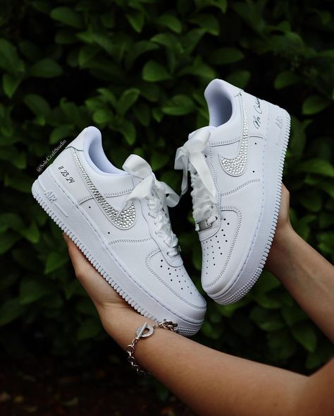 Stepping into forever with a touch of sparkle. ✨ Our custom Air Force 1 low bridal sneakers are the perfect blend of style and comfort for your special day. 👟💐. . . . . . . #BridalSneakers #CustomKicks #bridetobe #bride #weddingideas #weddingstyle #bridalshoes #bridestyle #bridesmaids #bridesmaid #nike #rhinestones #satin #airforce1 #customsneakers #sneakernews Sneakers For Bride, Wedding Sneakers For Bride, Jordan Wedding, Shoes Air Force, Bride Personalized, Bridal Sneakers, Wedding Sneakers, Custom Kicks, Wedding Hands