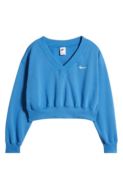 Minimally branded with an embroidered Swoosh, this classic sweatshirt is reimagined with a V-neck and cropped length. 19" length (size Medium) V-neck Ribbed cuffs and hem 80% cotton, 20% polyester Machine wash, tumble dry Imported Nike Women Outfits, Nike Sportswear Phoenix Fleece, Summer Sweatshirt, Fashion Layout, Classic Sweatshirt, Nike Pullover, Star Blue, Casual Preppy Outfits, Trendy Outfits For Teens