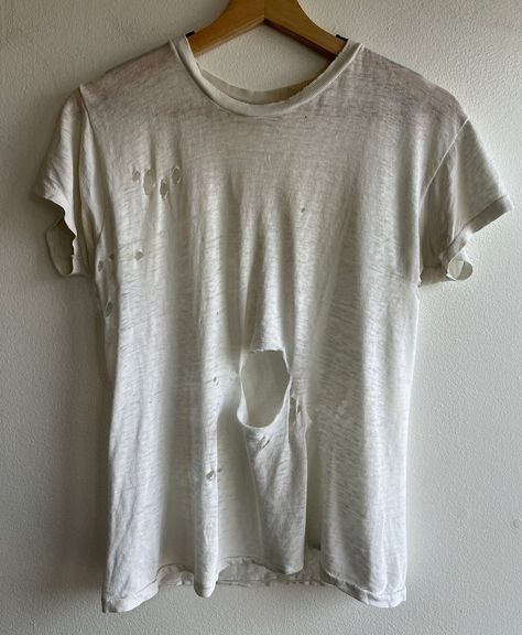 The Vintage communities obsession with Dirty, ripped and degraded shirts… Where people will buy sometimes up to 60 years old, dirty, torn and moth eaten shirts for often way over the price of a brand new tee Let’s have discussion, Would/do you wear these type of shirts? If so, why? Would you pay over the price of a brand new shirt for a shirt most people would consider trash? Orphan Costume, Torn Clothes, Distressed Tshirt, Ripped Shirts, Distressed Shirt, The Vintage, Types Of Shirts, Moth, Sewing