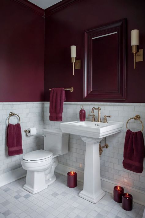 A burgundy half bathroom with a small sink, burgundy walls, and a round mirror creating a cozy space. Red And Green Bathroom, Burgundy Bathroom Decor, Aubergine Bathroom, Maroon Bathroom Ideas, Black And Red Bathroom, Dark Red Bathroom, Burgundy Bathroom Ideas, Maroon Bathroom, Burgundy Bathroom