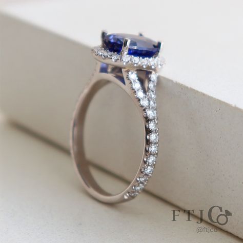 More is definitely more for this Princess Diana-inspired split shank sapphire halo ring. Not only does it feature a *large* blue oval sapphire (almost 2.5 ct), the halo and split shank are also encrusted with diamond pavé. It's a classic combo, taken to the max. 💎💙✨ . This is a Custom Oval Halo with a Diamond Pavé Split Shank made in our 18K AKARA People + Planet palladium white gold. It's set with a 2.48 ct Medium Blue Oval Mixed Cut Chatham lab grown sapphire, with twenty-two 1.2 mm SCS Cer... Sapphire Halo Ring, Twenty Two, Split Shank, Halo Ring, Halo Rings, Princess Diana, Medium Blue, Pave Diamonds, Lab Grown