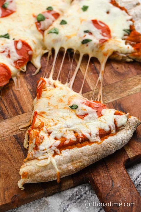 Grilled Pizza Dough Recipe - grillonadime.com Grilled Pizza Recipes On Stone, Homemade Pizza On Blackstone Griddle, Smoked Pizza On Pellet Grill, Pizza On Charcoal Grill, Easy Grilled Pizza, How To Grill Pizza On A Gas Grill, Grilled Pizza Dough, Pesto Cheese, Leftover Pizza