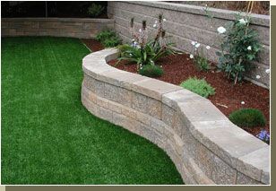 The bottom wall should match the top.  It would bring an element of design and architecture to the landscape. Retaining walls Retaining Wall With Flower Bed, Diy Retaining Wall Flower Bed, Curved Retaining Wall Garden, How To Build A Retaining Wall Flower Bed, Stone Flower Bed Border Retaining Walls, Garden Retaining Wall, Walled Garden, Raised Patio, Landscaping Retaining Walls