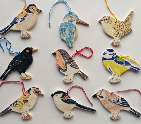 We have been making ceramic decorations for many years. Often sold as Christmas decorations, but we sell them throughout the year. They look good just hanging on a wall! Some of the decorations face the opposite way - just let me know if you have a preference. All of the birds are painted freehand so vary slightly - I can send you a picture of your chosen birds if you would like me to. The birds included are: Partridge, Kingfisher, Goldfinch, Long Tailed Tit, Wren, Robin, Jay, Chaffinch, Blue Ti Bird Decorations, Clay Bird, Chaffinch, Bird Christmas Ornaments, Bird Christmas, Ceramic Bell, Christmas Bird, Etsy Christmas, Bird Ornaments