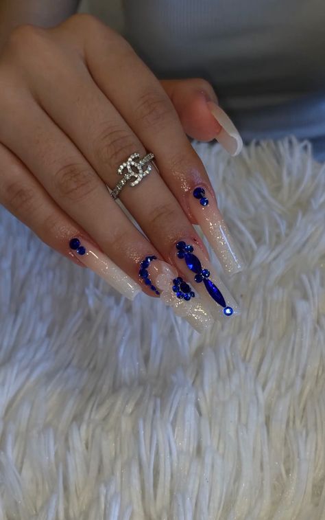 Light Blue Acrylic Nails Design Quince, Blue Rhinestone Acrylic Nails, Blue Marble Nails With Rhinestones, Blue Nail Designs With Gems, Royal Blue Nails Xv, Navy Blue Tapered Square Nails, Tapered Square Nails Royal Blue, Blue Acrylics With Rhinestones, White Nails Blue Rhinestone