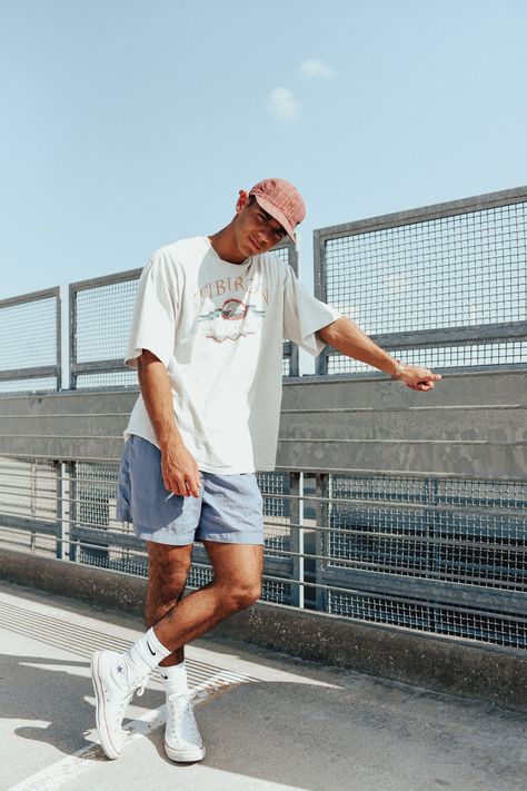 Find a look like this on The Real Trendy Traps website. Just some inspiration on how to style a large shirt with some short pants. #summer #vintage #fashion #mens #style #TheTrendyTrap #inspiration #inspo #90s #outfit #outfits #streetwear 90s Fashion Men Summer, Vintage Streetwear Men, Summer Fits Men, Skate Outfit, Mens Street Style Summer, Summer Outfits Men Streetwear, Mens Summer Outfits, Streetwear Shorts, Outfits Streetwear