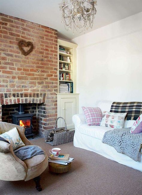 Readers’ Choice 2011: Sarah Locke and Stephen Bradshaw bought this Victorian cottage not far from the Lancashire coast in 2009; in less than one year they have completely renovated it, bringing out its character. See more: http://www.periodliving.co.uk/homes-gardens/readers-homes/renovated-shrimpers-cottage Exposed Brick Fireplace Living Room, Brick Fireplace Living Room, Exposed Brick Chimney, Exposed Brick Fireplace, Brick Chimney Breast, Country Fireplace, Cottage Lounge, Brick Fireplaces, Period Living