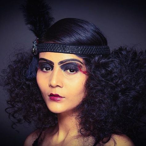 Totally for the hair!!   Top 100 frizzy hair photos Loved shooting this 1920's inspired MODERN GOTHIC look  Model: @shruti_maheshwari  Hair: @fatmupromakeup  Makeup & Styling: @shreya_roy  #1920s #modern #gothic #frizzyhair #fashion #makeup #styling #shoot #beauty #colour See more http://wumann.com/top-100-frizzy-hair-photos/ Great Gatsby Curly Hairstyles, 1920s Curly Hair, 1920s Hair Black Women, Gothic 1920s, 1920s Hair Long, 1920s Halloween Costume, Hairstyles 1920, Halloween Destinations, 20s Hair