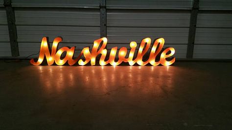 Lighted Nashville sign  63 by 13 inches  Its perfect for your house, bar, or any outdoor or indoor area. It is great quality.  Ask about custom signs!  Check out our stuff!!!!   https://www.etsy.com/shop/GardenMetalDecor   Thank you for visiting our store Nashville Sign, Marquee Signage, House Bar, Marquee Lights, Marquee Sign, Light Up Signs, Cursive Font, Marquee Letters, Wood Ideas