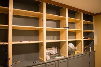 How to make your own custom built-ins with cheap cabinets - It makes the space so comfy. Make Your Own Book, Tv Kastenwanden, Unfinished Cabinets, Cheap Cabinets, Office Remodel, Closet Organization Diy, Custom Built Ins, Bookshelves Diy, Built In Bookcase