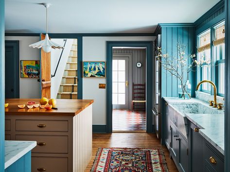 Bespoke wooden island with cabinets that feature brass handles and ample storage space - Decoist Borge Mogensen Chair, Hendricks Churchill, Wooden Island, Library Table, Popcorn Ceiling, Eclectic Kitchen, Farmhouse Chic, Churchill, Ceiling Fixtures