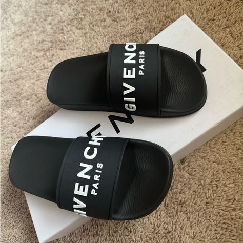 Beautiful Black Slides! A Bold Givenchy Logo Stamp Crosses The Wide Strap Of A Cushy, Water-Friendly Rubber Slide Sandal. Givenchy Rubber Sandal Slide. Platform Rubber Sole; 1"H. Open Toe. Vamp Strap. Logo Lettering At Strap And Sole. Molded Footbed. Slip-On Style. Made In Italy. Givenchy Slides, Givenchy Logo, Givenchy Shoes, Black Slides, Rubber Sandals, Shoes Brand, Logo Stamp, Wide Straps, Slide Sandals