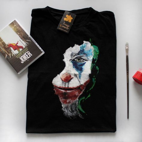 Hand painted black t-shirt, Joker movie motive. DM to order. Visit me on Instagram @hugandwear Hand Painted T Shirt For Men, Joker Hand, Painted T Shirt, Joker Movie, Shirt Painting, Diy Pants, Painted Clothes Diy, Clothes Art, Tshirt Painting