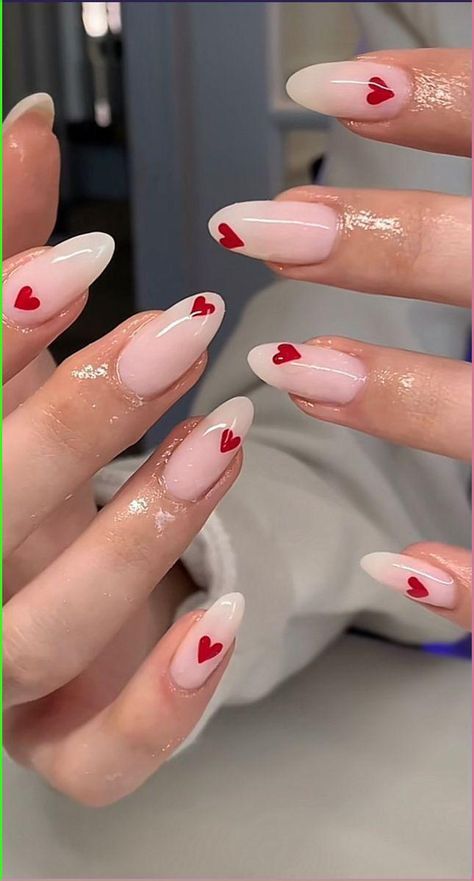 Valentine Red Heart Nail Ideas | February Nail Inspo | Hearts nail ideas #vday #valentinesday Trendy Almond Nails Valentines, Valentine Day Nails Simple, Heart Nail Stickers, Valentines Nails2023, Almond Acrylic Nails Heart, Pink Nails With Red Heart On Ring Finger, Cute Simple Valentines Nails Almond, Small Hearts On Nails, Sparkly Valentines Day Nails