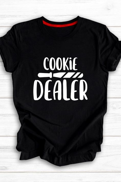 "Indulge your sweet tooth with our 'Cookie Dealer' graphic shirt! This trendy t-shirt is perfect for cookie lovers and baking enthusiasts alike. Its unique design features a humorous slogan that showcases your love for all things cookies. Made with high-quality materials, this fashion-forward statement tee is a must-have for any foodie fashionista. Whether you're a baking aficionado or simply appreciate a good cookie, this funny and stylish shirt is sure to turn heads.    " Cookie Shirt, Statement Tees, Fashion T Shirt, Stylish Shirt, Trendy Tshirts, Graphic Shirt, Shirt Fashion, Stylish Shirts, Graphic Shirts