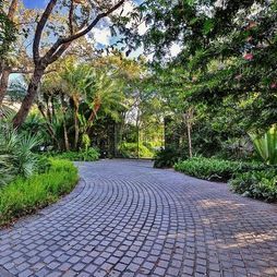 Tropical Landscape Driveway Design, Pictures, Remodel, Decor and Ideas Driveway Entrance Landscaping, Brick Driveway, Tropical Landscape Design, Driveway Entrance, Driveway Design, Front Garden Design, Driveway Landscaping, Paver Driveway, Tropical Landscape