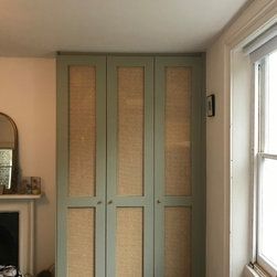 Rattan doors wardrobe built in the chimney alcove. Rattan Wardrobe Doors, Loft Conversion Wardrobes, Floor To Ceiling Wardrobes, Alcove Wardrobe, Alcove Cabinets, Doors Wardrobe, Small Space Nursery, Rattan Doors, Bespoke Wardrobe