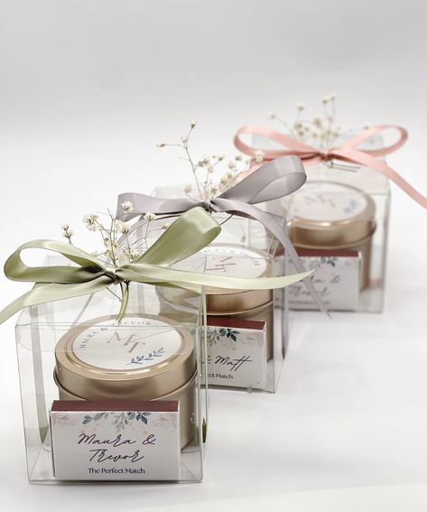 "Enhance the ambiance of your special day and etch lasting memories with our exquisite wedding candle favors. Our candles feature a blend of meticulously curated essential oils and nature-identical fragrance oils, offering a premium, all-natural scent experience that promotes relaxation, energy, and an uplifting mood, imbued with calming and balancing properties. Crafted with care, these customized sets embody thoughtfulness and functionality, making them ideal wedding favors. Not only do they provide a convenient source of candlelight and more, but they also serve as cherished mementos, preserving the magic of your extraordinary day. Choose from a diverse array of scents, styles, colors, and designs that seamlessly harmonize with your wedding theme and decor, ensuring a perfect complement Candle And Matches Wedding Favor, Wedding Favors Candles, Candles Wedding Favors, Return Favours, Seed Wedding Favors, Candles Wedding, Elegant Wedding Favors, Christening Favors, Candle Wedding Favors