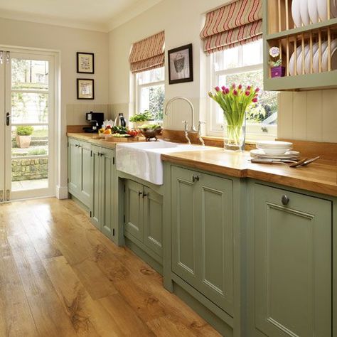 Painted kitchen | Step inside this traditional soft green kitchen | Reader kitchen | PHOTO GALLERY | Beautiful Kitchens | Housetohome Soft Green Kitchen, Beautiful Kitchen Cabinets, Interior Dapur, Kabinet Dapur, Green Kitchen Cabinets, Cottage Kitchens, Green Cabinets, Wooden Floors, Hus Inspiration