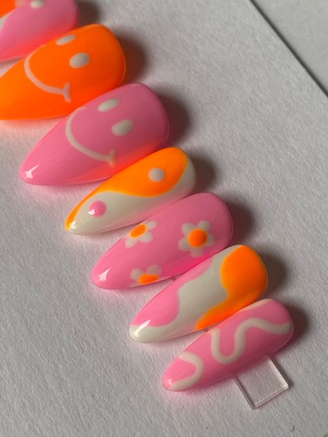 "Hand painted orange and pink mismatched gel press on nails with yin yang, smiley face, floral, abstract swirl design. Nails pictured are STILETTO SHORT shape. PLEASE READ: I sell nail sizing kits so you can try the sizes at home to find your perfect fit before ordering if you choose. You can find this on my shop under \"NAIL SIZING KIT.\" OR Use the nail sizing chart instructions from the photos to measure your nails. Then choose from the nail size options XS, S, M, or L. If your nails do not f Happy Face On Nails, Spirit Week Nails, Light Pink And Orange Nails, Happy Birthday Nails Designs, Swirl Design Nails, Retro Nail Designs, Happy Face Nails, Pink Orange Nails, Quirky Nails