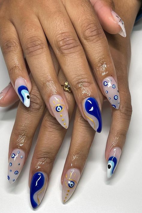 35 Enchanting Evil Eye Nails for a Mysterious and Trendy Manicure Dark Blue Nails Evil Eye, Nail Design With Evil Eye, Evil Eye White Nails, Evil Eye Nails With Gold, Greek Inspo Nails, Navy Halloween Nails, Googly Eye Nails, Evil Eye Nails Red, Greek Acrylic Nails