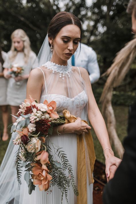 Moody, cascading fall wedding bouquet of pepper tree leaves, orchids, tuber roses, carnations, anemone and ranunculus in burnt orange, cream and green.  Click to see more of this outdoor eclectic farm wedding: http://www.confettidaydreams.com/burnt-orange-and-greenery-farm-wedding/  #moodywedding #wedding #bouquet #farmwedding #fallwedding #weddingideas #rusticwedding Wedding With Pampas, Cascading Bouquet, Fresh Wedding Flowers, Eclectic Wedding, Grass Wedding, Cascade Bouquet, Fall Wedding Flowers, Floral Ideas, Wedding Flower Arrangements