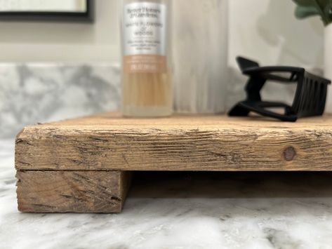 Handmade Vintage-Inspired Countertop Stand Enhance your space with our handmade countertop stand, designed to add character and charm. This piece is perfect for displaying cooking oils, salt and pepper shakers, butter dishes, or even for organizing hand soaps and towels in your restroom. Each stand is crafted from pine and meticulously handcrafted to achieve a vintage and weathered look. We use a variety of techniques to ensure each piece is unique. Due to the nature of rustic wood, no two stand Bathroom Countertop Tray, Bathroom Counter Tray, Gingerbread Contest, Countertop Tray, Decor Stand, Antique Bench, Kitchen Tray, Hand Soaps, Support Plante