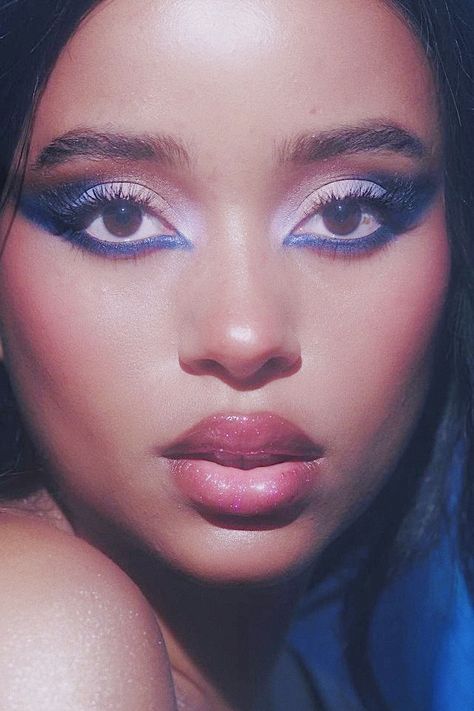 A photography shot of a woman wearing an electric blue Smokey eye look with a nude ombré lip 70s Make Up Black Woman, 70s Makeup Look Black Women, Blue Makeup Ideas For Black Women, 70s Disco Makeup Black Women, 70s Make Up Looks Disco, Blue 60s Makeup, Blue 70s Makeup, Electric Blue Eye Makeup, 70s Makeup Black Women