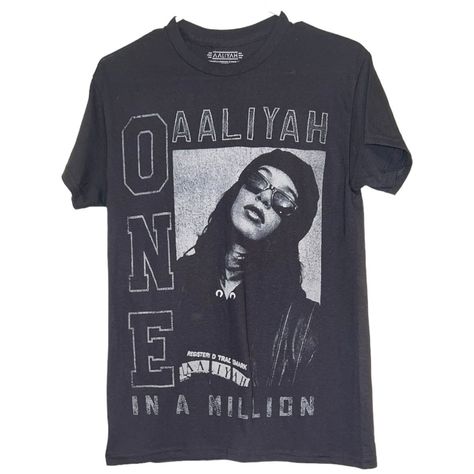 Aaliyah Vintage Retro Short Sleeve Band T Shirt Size Small Nwot Vintage Rock Music Black And Gray Aaliyah Could Be Unisex Aaliyah “One In A Million” T-Shirt Description: Celebrate The Legacy Of One Of R&B’s Most Iconic Figures With This Vintage Aaliyah “One In A Million” T-Shirt. Featuring A Striking Portrait Of Aaliyah, This Tee Is A Nod To Her Timeless Influence In The Music And Fashion World. Crafted From High-Quality Cotton, It Offers Both Comfort And Durability, Making It A Perfect Addition To Any Fan’s Wardrobe Or Vintage Collection. The Bold Design And Classic Black Color Ensure It Stands Out In Any Casual Outfit. Don’t Miss Your Chance To Own A Piece Of Music Histo Aaliyah One In A Million, Aaliyah Shirt, Aaliyah T Shirt, Music Black, Rock Band Tees, Music Tees, Retro Shorts, Rayon Shirt, Vintage Rock