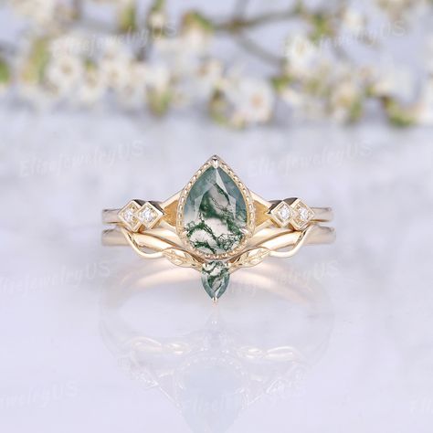 Dainty Moss Agate Engagement Ring Set Pear Agate Rings Moissanite Gold Rings Dainty Leaf Wedding Rings Set Twig Band Promise Rings Set Moss agate is natural, and each agate is different. This makes each piece of moss agate jewelry unique. It is normal that the agate on the finished jewelry won't be the same as our pictures. Every moss agate used is carefully selected by me. But if you want to choose the stone yourself, I provide MOSS AGATE SELECTING SERVICE : https://www.etsy.com/listing/1466114 Leaf Wedding Ring Set, Promise Rings Set, Fairytale Engagement Rings, Rings Moissanite, 6mm Wedding Band, Agate Rings, Leaf Wedding Rings, Wedding Rings Set, Moss Agate Jewelry