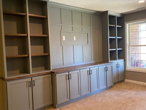 Theater Room Cabinets Built Ins, Ikea Living Room Cabinets Built Ins, Built In Shelves Basement Family Room, Entertainment Center Paint Ideas, Sage Built In, Shallow Built In Cabinets, Sage Green Built In Bookshelves, Illusive Green Sherwin Williams Cabinets, Basement Built In