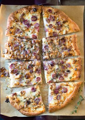 It's amazing what you can do with a pound of pizza dough. Of course you can make a traditional pizza, but why not get a little more creative? This easy flatbread, which can do double duty as an appetizer or as a full meal, has a fun combination of grapes, Taleggio cheese, and walnuts — all on whatever pizza dough you like best. Chicken In Milk, Best Chicken Recipe, Taleggio Cheese, Easy Flatbread, Flatbread Recipes, Flatbread Pizza, Best Chicken Recipes, Great Appetizers, Full Meal Recipes