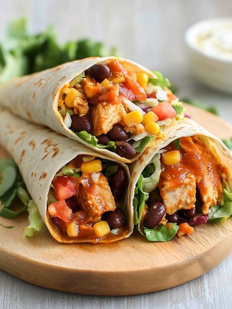 Upgrade your meal game with this Southwest Chicken Wrap! Packed with seasoned chicken, crisp veggies, black beans, and a zesty sauce, it’s a delicious and nutritious option for busy days. Make them ahead for a no-fuss, satisfying meal anytime. Try it now!

#ChickenWrapIdeas #SouthwestFlavors #HealthyWraps #MealPrepMadeEasy #QuickBites Southwest Chicken Wraps, Southwest Seasoning, Zesty Sauce, Healthy Wraps, Southwest Chicken, Chicken Wrap, Seasoned Chicken, Chicken Wraps, Game Food