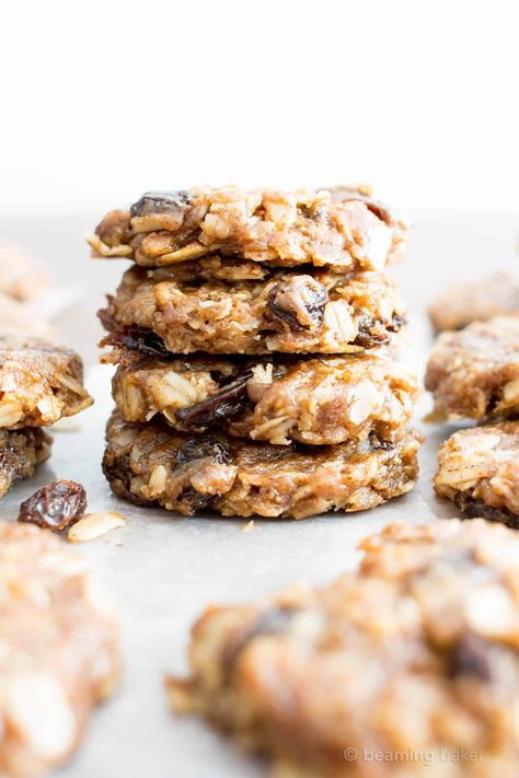 4 Ingredient No Bake Chewy Oatmeal Raisin Cookies (V, GF): an easy recipe for delightfully chewy no bake cookies bursting with raisins and cinnamon flavor! #Vegan #GlutenFree #DairyFree #Cookies #NoBake #Dessert | Recipe on BeamingBaker.com No Bake Oatmeal Raisin Cookies, Gluten And Dairy Free Oatmeal Raisin Cookies, Vegan No Bake Oatmeal Cookies, Gluten Free Oatmeal Raisin Cookies Chewy, Clean Oatmeal Raisin Cookies, Vegan Oatmeal Raisin Cookies Chewy, Oat And Raisin Cookies, Nobake Dessert, Chewy Oatmeal Raisin Cookies