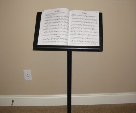 My girlfriend is a music major and she needed a music stand in order to practice. As it turns out, music stands aren't cheap, so I decided to build her one from some parts lying around my basement. (I did have to buy a few things). Music Major, Craft Fair Booth Display, Sheet Music Stand, Book Art Sculptures, Music Stands, Diy Music, Baroque Furniture, Craft Fairs Booth, Piano Room