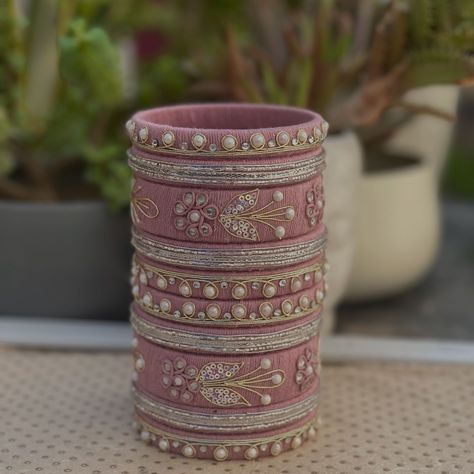 Unique bangles by Rashi | Pastel pink and pearl bangles, a match made in heaven 💕✨ Beautiful bangles for beautiful lady 💕✨ Dm your outfits pictures and let the... | Instagram Unique Bangle Designs, Pink Bangles Set, Fabric Bangles, Pearl Bangles, Silk Thread Bangles Design, Beautiful Bangles, Thread Bangles Design, Unique Bangle, Fabric Jewellery