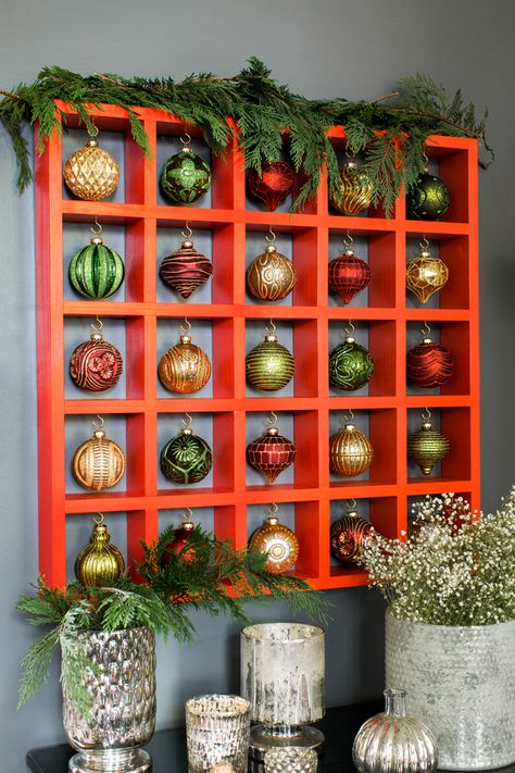 This DIY Pigeon Hole Display For Your Ornaments is a great way to build cheer this year. See instructions here.   Put your cheer on display with this unique DIY Pigeon Hole Display For Your Ornaments. The full how-to is just a click a way. Heavy Ornament Display, Displaying Christmas Ornaments For Sale, Christmas Bauble Display Ideas, Glass Ornament Display Ideas, Ornament Collection Display, Unique Ornament Display, Bell Display Ideas, Displaying Knick Knacks, Displaying Christmas Ornaments