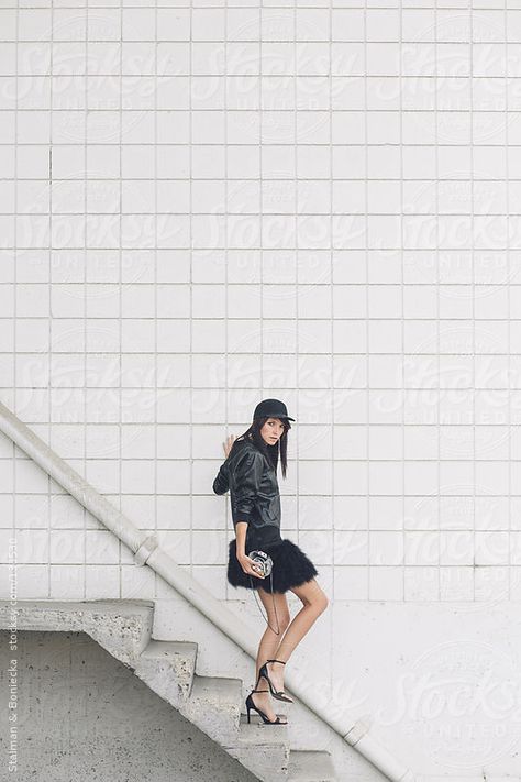 A woman walking down a flight of stairs dressed in all black by Stalman & Boniecka #stocksy #realstock Woman Walking Down Stairs, Walking Down Stairs Reference, Stair Poses, Walking Down Stairs, Shoes Pose, Female Modeling Poses, Walking Up Stairs, Board Illustration, Vintage Film Photography