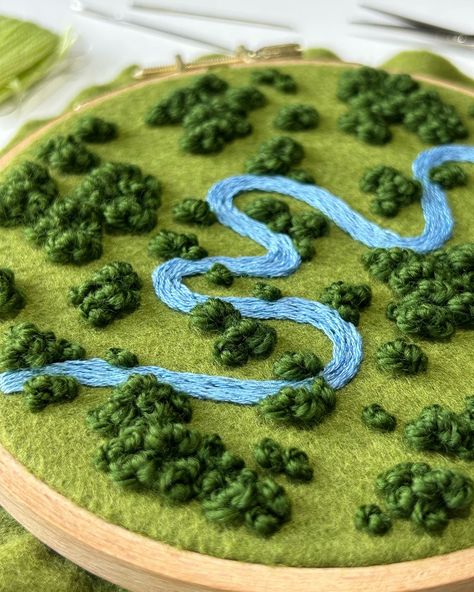 Progress on this floral river landscape ✨ Do you like this crazy winding river? Let me know! I found some aerial photos with twisting and turning rivers, and I really wanted to include all that movement into a piece. This is a 5 inch hoop with lots of movement and texture so far. I can’t wait to add the flowers! . . . @dmc_embroidery @dmc_crafts #embroidery #embroidered #needlework #handembroidery #fiberart #fibreart #textileart #dmc #threads #dmcthreads #embroideryartist #embroideryart #... Aerial Landscape Embroidery, River Embroidery, Aerial Embroidery, Weather Embroidery, Moss Embroidery, Embroidery Map, Aesthetic Embroidery, Plant Embroidery, Landscape Embroidery