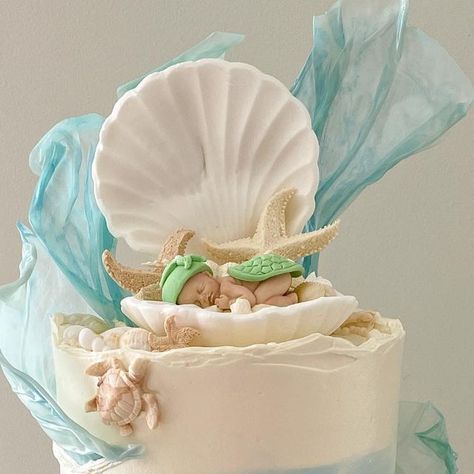 Baked by Jamaine on Instagram: "When I get to have full creative control for a ocean inspired baby shower cake and it turns out even better than I had envisioned!! 🥹 Hands down my most favourite cake I have made to date! 🤍 . . @colour.mill colours - white, baby blue, bluebell, Tiffany & caramel Baby, turtle, seahorse, seashell and starfish silicone moulds all from @okhachbakingsupplies @cakersparadise @cakebaseaus  @inspiredbyzaraz - sprinkles  . . #cake #cakedecorating #babyshowercake #oceaninspired #cakesofinstagram #buttercreamcake #baking #bakinglove #colourmillmade" Ocean Baby Shower Cake, Seashell Cake, Sprinkles Cake, Ocean Baby Showers, Caramel Baby, Baby Inside, Beach Cakes, Silicone Moulds, Ocean Inspired