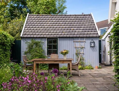 Learn how to refresh the paint on a wood or metal shed with a step-by-step guide from the experts at Benjamin Moore, including helpful tips and project duration. Long Wooden Dining Table, Painting Shed, Pitcher With Flowers, Brick Shed, Prefabricated Sheds, Blue Shed, Prefab Sheds, Vinyl Sheds, Build A Shed