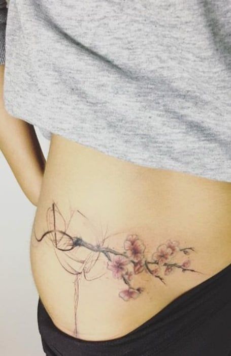 50 Sexy Hip Tattoos for Women (2023) - The Trend Spotter Tattoo On Hip Bone, Flowers Tattoos, Tattoo Hip, Female Tattoos, Bone Tattoos, Hip Tattoos Women, Tattoos Women, Cherry Blossom Tattoo, Blossom Tattoo